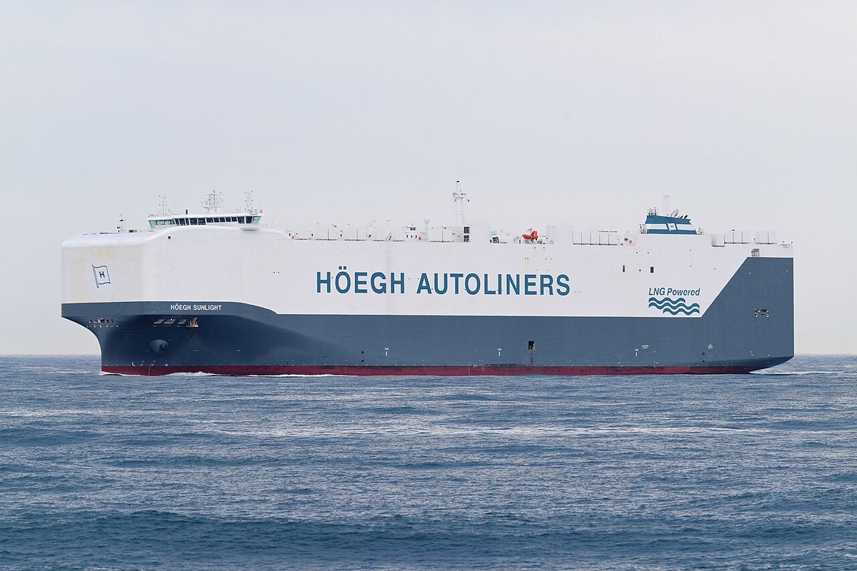 A large white car-carrier ship at sea