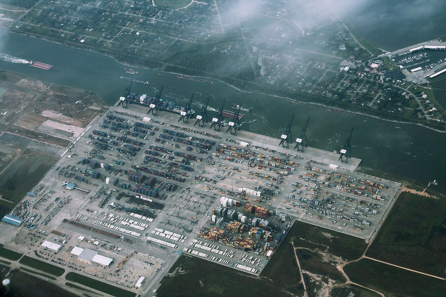 Aerial view of stacked shipping containers and cranes at Bayport Container Terminal near Houston